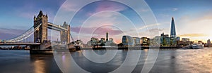 Panoramic view to the famous Tower Bridge and cityscape of London, UK