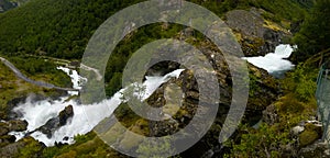 Panoramic view to kleivafossen waterfall at briksdalselva river, Briksdalsbreen glacier, Norway