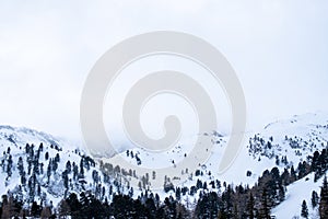 Panoramic view to mountain GroÃŸer BÃ¶senstein on a cloudy winterday