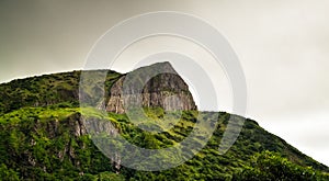 Panoramic view to Rocha dos Bordoes aka Catchphrases cliff at Flores, Azores, Portugal photo