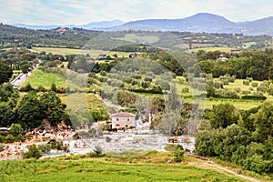 Panoramic view to Saturnia spa town with hot spring and waterfall at Cascate del Mulino photo