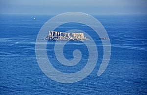 Panoramic view to the sea with the view to island Filfla in Malta. Smal island near Malta coast. Dingli clifs in Malta and scenic