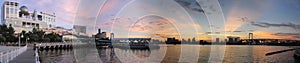 Panoramic view of Tokyo Bay and Rainbow bridge from Aqua City at sunset. Odaiba, Japan