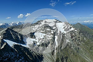 Panoramic view from top of Hohe Sonnblick in Austrian Alps on Grossglockner. The whole area is partially covered with snow