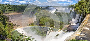 Panoramic view from top of the waterfalls with a rainbow to Iguazu river and San Martin Island, Iguazu Falls, Argentina photo