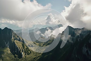 panoramic view of towering mountain range with clouds scudding across the sky