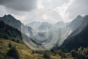 panoramic view of towering mountain range with clouds scudding across the sky photo