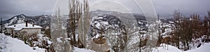 Panoramic View of the town of Terranova di Pollino in Winter, Covered with Snow photo