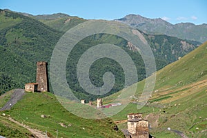 Panoramic view on traditional ancient Svan towers and surrounding hills in Ushguli, Svaneti, Georgia