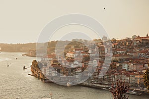 Panoramic view of traditional rabelo boats with barrels of Port wine on the Douro river, Ribeira and Dom Luis I or Luiz I iron