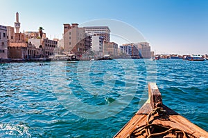 Panoramic view from traditional water taxi boats in Dubai, UAE. Creek gulf and Deira area. United Arab Emirates famous tourist