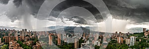 Panoramic view of two shower storms washing MedellÃ­n, in Colombia