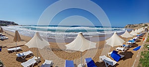 Panoramic view of umbrellas and sunbeds in Davlos beach, Cyprus
