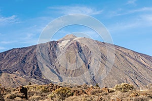 Panoramic view of unique Roque Cinchado unique rock formation with famous Pico del Teide mountain volcano summit in the background