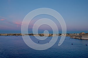 Panoramic view of Valletta and Kalkara on sunset hours. Malta