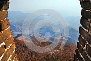 Panoramic view of the valley close to the Mutianyu section from a tower of the Great Wall of China, surrounded by