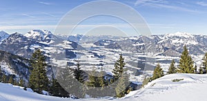 Panoramic view of a valley among the mountain peaks of the winter Alps