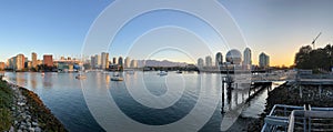 Panoramic view of the Vancouver skyline across the water from the Olympic Village