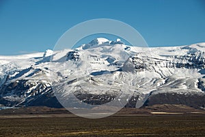 Panoramic view of Vatnajokull Vatna ice cap glacier snow covered mountain peak summit in South Iceland Europe