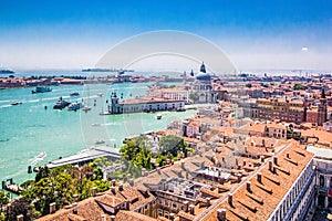 Panoramic view of Venice - Basilica Santa Maria della Salute, Grand Canal with gondolas and red tiled roofs of houses, Venice,