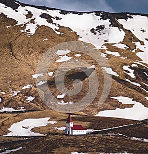 Panoramic view of the Vik at sunrise sunset . South Iceland.Typical red colored wooden church in Vik town, Iceland in