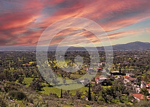 Panoramic view of the villages with gardens and vineyards on island of Evia in Greece at sunset