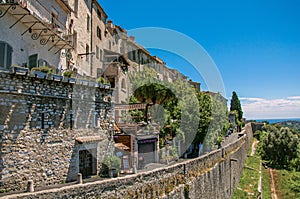 Panoramic view of wall, houses and shops in Saint-Paul-de-Vence.