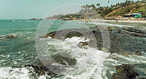 Panoramic view on wave of ocean waters and palm trees beach. Asian holiday landscape