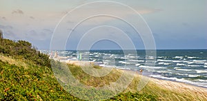 Panoramic view of the wavy sea coast on a sunny summer day in Sventoji