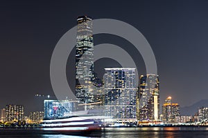 Panoramic view of West Kowloon and Victoria Harbour in Hong Kong at night.