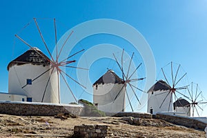 Panoramic view of white windmills and blue sky on the island of Mykonos, Greece