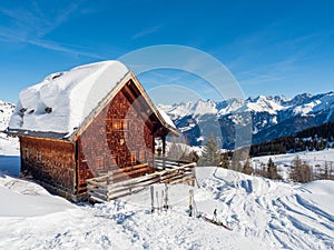 Panoramic view with wood house in winter in resort Ladis, Fiss, Serfaus in ski resort in Tyrol