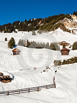 Panoramic view with wood house in winter in resort Ladis, Fiss, Serfaus in ski resort in Tyrol