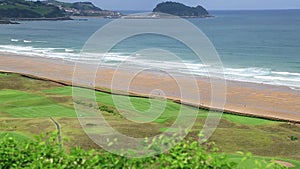 Panoramic view of Zarautz with Guetaria on the background on a bright sunny summer day.