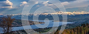 Panoramic view of Zurich lake and the snow-capped Swiss Alps from the top of Uetliberg mountain