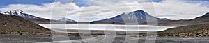 Panoramic views across Laguna Honda and volcanic landscapes of the Cordillera Occidental, Sud Lipez, Uyuni, Bolivia