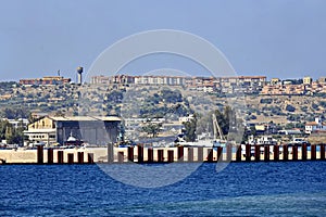 Panoramic views of the coastline, town, piers, ships at anchor. Landscape. Port of Augusta, Italy.2024 photo