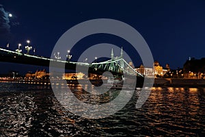 Panoramic views of night bridges through Danube with illumination.