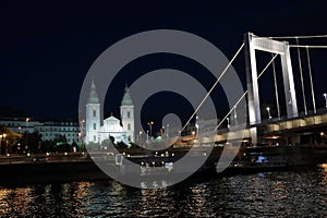 Panoramic views of night bridges through Danube with illumination.