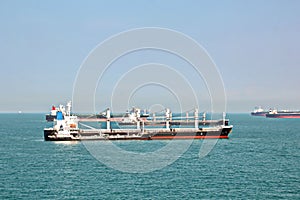 Panoramic views of the port and the city of Singapore during day and night. Kind of cargo and merchant vessels anchored.