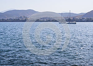 Panoramic views of sea, the mountains and yachts on Liani Ammos beach in Halkida, Greece on a Sunny summer day  the island of Evia