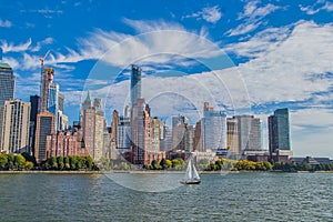 Panoramic views of the skyline by boat during the day.