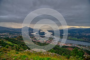 Panoramic of Vila Nova de Cerveira. Vila Nova de Cerveira, top of the mountain view over Minho River and Caminha at sunset.