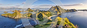 Panoramic warm view at top of `Padar Island` in sunrise late morning from Komodo Island, Komodo National Park, Labuan Bajo, Flor