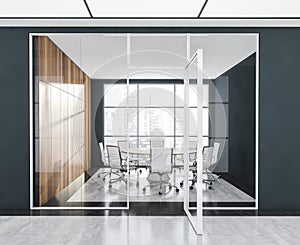 Panoramic white, dark blue meeting room interior with round table, wooden cabinet
