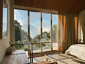 Panoramic windows in bedroom with stunning view