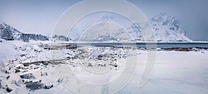 Panoramic winter scene of Vestvagoy island. Snowy mountain peak on Lofoten Islands, after huge snowfall