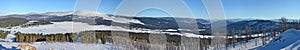 Panoramic winter view of the snow-covered slopes of the Altai mountains, Siberia, Russia