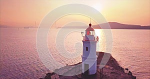 Panoramic zooming out aerial view of old lighthouse at sunrise. Vladivostok