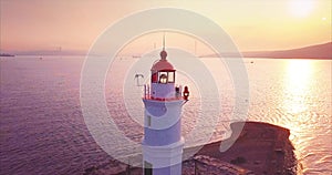 Panoramic zooming out aerial view of old lighthouse at sunrise. Vladivostok